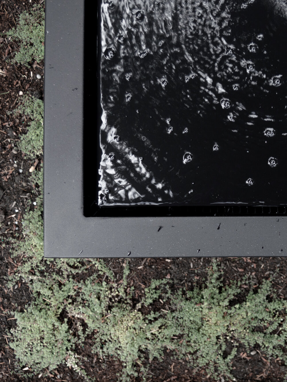 Modern square feature fountain made from a planter box.jpg